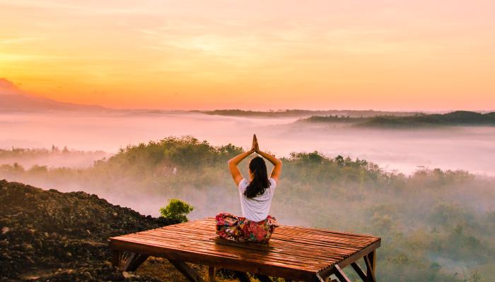 Meditating on a mountain.