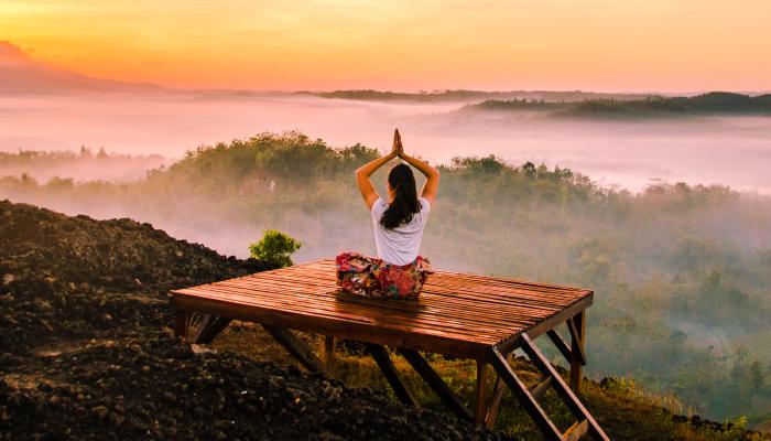 Meditating on a mountain.